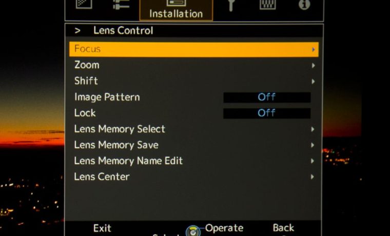 Lens controls to set lens memory, then retrieve them. (Or control using the remote.)
