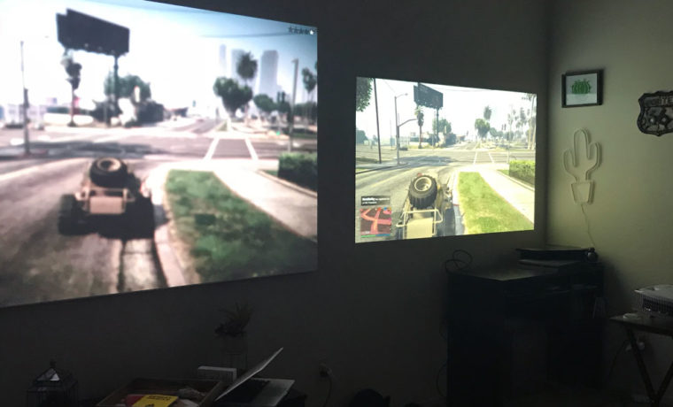 This is our workaround for the lack of good split screen co-op games available for PS4. Two projectors side by side, playing online together.