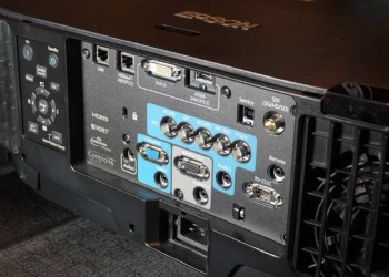 The back panel of the Epson Pro L1755 projector contains the control panel along with all inputs and connectors