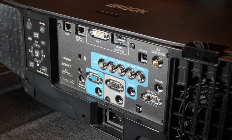 The back panel of the Epson Pro L1755 projector contains the control panel along with all inputs and connectors