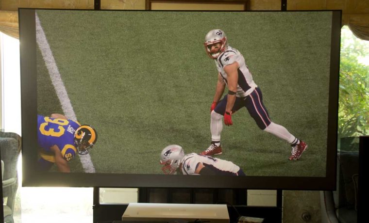 An HDTV football game, projected by the LG HU85LA in ambient light, using an ALR screen designed for UST projectors.