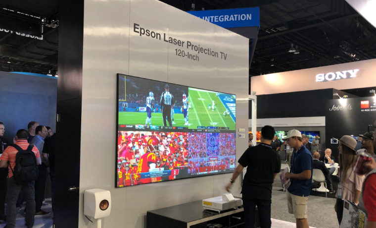 The Epson LS500 laser TV “dazzled” under full trade show floor lighting on this 100” diagonal screen!