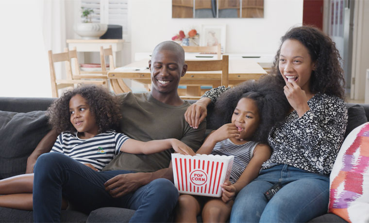 Family-Watching-Movie-with-Popcorn