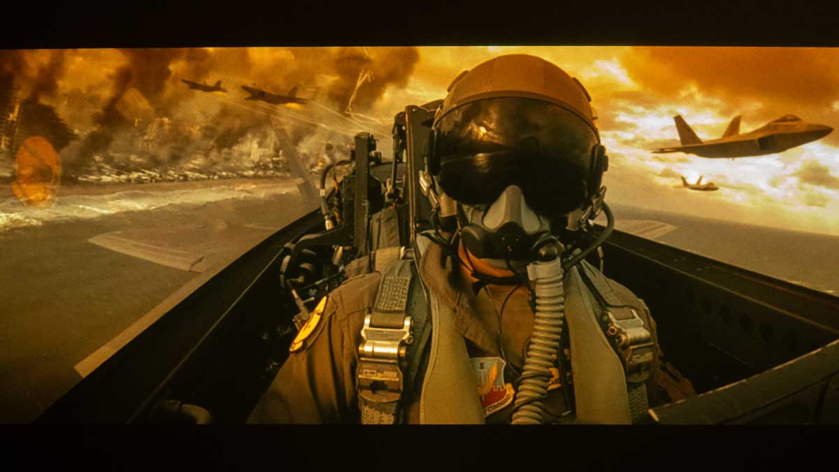 LG CineBeam HU715Q displaying an image of a pilot in a fighter jet