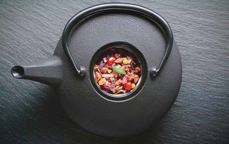 Herbs in a tea kettle