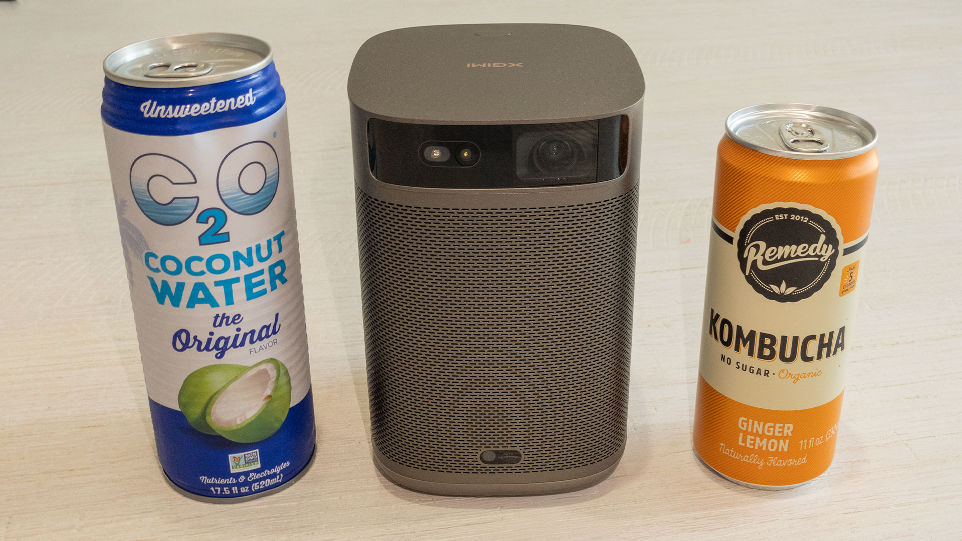 Xgimi Mogo 2 Pro Size Compared to Beverage Cans - Projector Reviews - Image